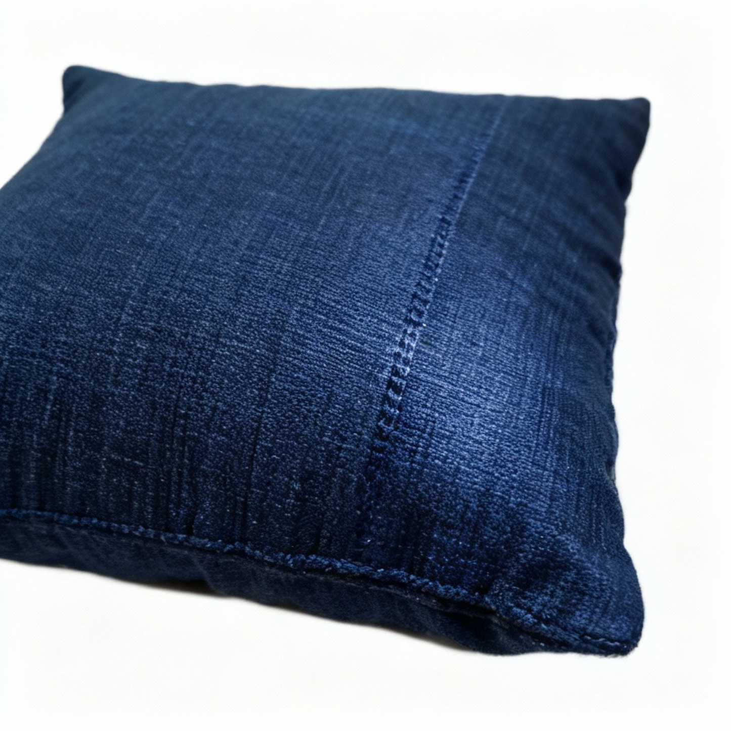 Indigo diamond pattern pillow cover made from hand-woven cotton.