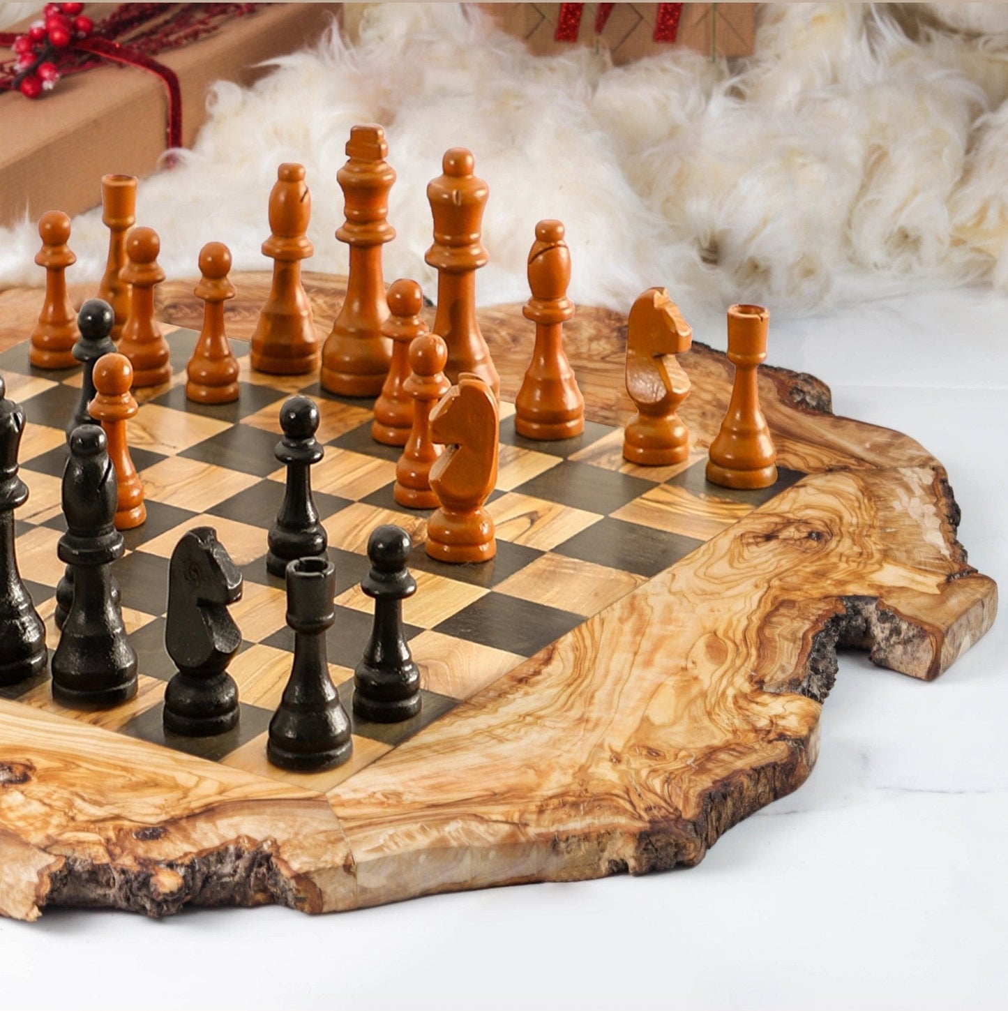 Handmade olive wood chess set with natural edges and black and brown pieces.
