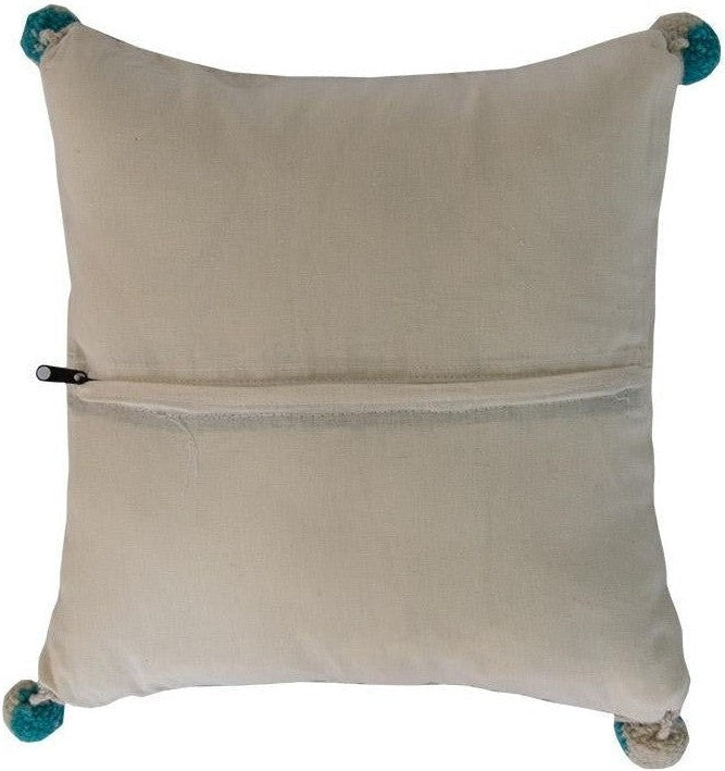 Beige pillow with teal pom-poms and a zipper closure.