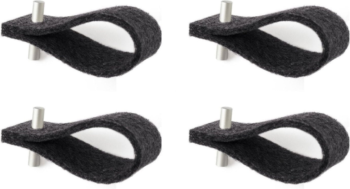 Set of four minimalist black felt napkin rings with silver metal accents.