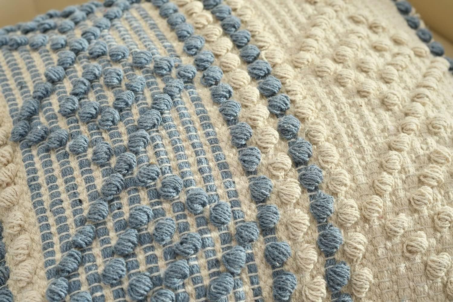 Close-up of textured fabric with blue and beige pattern