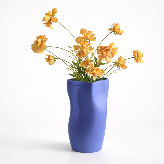 Blue vase with yellow flowers on a white background
