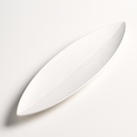 White ceramic plate with textured surface on a light gray background