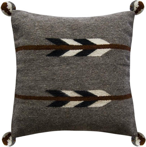 Grey pillow with brown, black, and white arrow pattern and pom-poms.