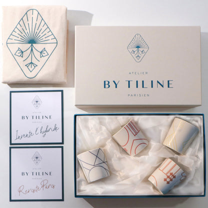 Luxury gift box of four handmade Hybrides Paris candles in elegant white packaging