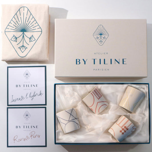 Luxury gift box of four handmade Hybrides Paris candles in elegant white packaging