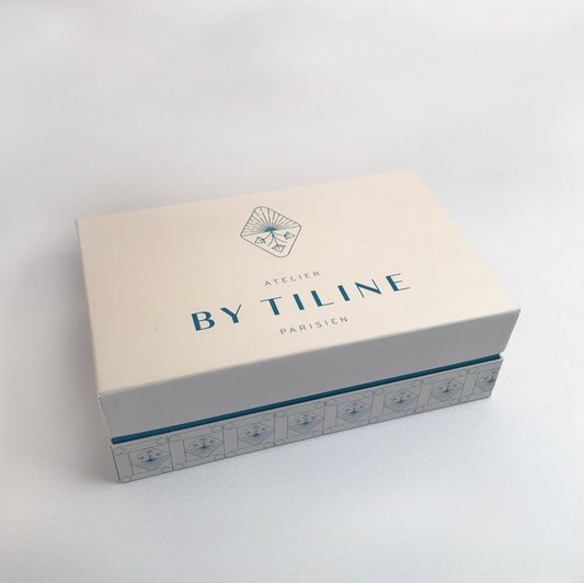 Coffret de Quatre scented candle set by Hybrides Paris in white and neutral tones